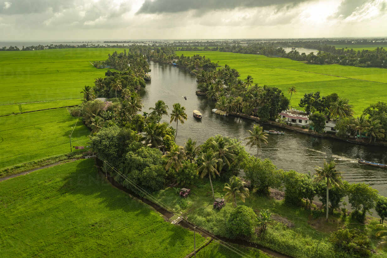 aerial view of boats sailing the river water in alappuzha, kerala, india.